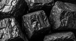 © yuwaree - Natural black coal lumps with sharp edges and dark matte textures create a dense, organic background for industrial and energy-themed designs, dark, charcoal, rock