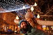 © Impact Photography - Man piggybacking woman while celebrating New Year outdoors in the city streets