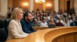 © Lamduan - Study of amendment documents by city council members seated at a curved chamber dais before casting electronic votes