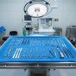 © RIOKO - Surgical Instruments Arranged On A Blue Drape In An Operating Room