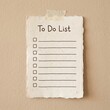 © Tasnim - Blank To Do List on textured paper taped to a wall for planning and task management