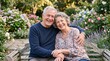 © Felippe Lopes - Happy senior couple embracing on a park bench surrounded by blooming flowers and lush greenery