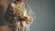 © Good - Person wearing white cozy sweater holding bouquet of dried flowers and lit candle with hygge lifestyle warm lighting candlelight winter mood peaceful