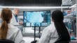© DC Studio - Senior scientist presents new drug development findings to a pharmaceutical team in the lab, pointing to cellular reactions on a large screen during training.