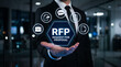 © Nasima88 - Businessman holding RFP request for proposal icon virtual corporate concept