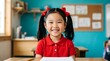 © Sikder - Young asian schoolgirl sitting at a desk in a classroom