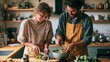 © Ali - Young couple preparing a fresh salad together in a bright modern home kitchen