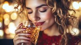 Woman enjoying a drink in a festive setting