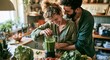 © akeil - Happy couple preparing a healthy green smoothie together in a cozy home kitchen