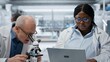 © DC Studio - Pathologist examines a biopsy slide while a coworker records diagnostic findings on a laptop, working together to identify disease markers in a clinical lab.