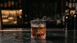 © DarkFrame Studio - Smoked whiskey cocktail with black salt rim and ice cube on dark marble bar counter in cinematic moody lounge.