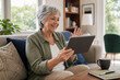 © Thodsapol - Older Man Managing Household Finances with a Smartphone and Laptop at Home, Reviewing Digital Documents, Online Banking, Budget Planning, and Secure Technology Use