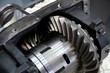 © SKfoto GE - Close-up of the gear wheel of a large industrial gearbox. Sample of agricultural machinery. Selective focus.