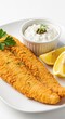 © Hugnaka - Golden brown fried catfish fillets served on a plate with a side of creamy tartar sauce, fresh lemon wedges, and a green parsley garnish, dish, crusty, bowl
