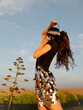 © UM STUDIO/Stocksy - Sequin Skirt Fashion Portrait At Sunset