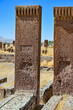 © GrebnerFotografie - Medieval Seljuk tombstones made of red stone, featuring elaborate engraved inscriptions, in the historic cemetery of Ahlat (Ahlat Selcuklu Mezarligi) under a blue summer sky, Turkey