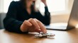 © Stock Spectrum - Close up of a female professional playing with a fidget spinner while working on a laptop in an office setting.