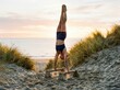 © Leo Rohmann - Handstand Training on Parallettes at a Sunrise Beach