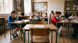 © Виталий Канев - Empty school desk in classroom with children in background
