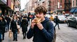 © P.F.C.N - Teenager eating a cinnamon roll on a busy city street with blurred background traffic and pedestrians