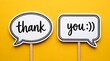 © MdIbrahim - Two white speech bubbles with thank you text message on yellow background providing polite communication concept for customer appreciation or greeting card.