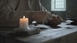 © diablosiatr - Hands of a prisoner cutting a quill pen with a knife over a rustic table, with a blurred burning candle in the foreground inside a dark dungeon cell
