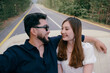 © Azamat Mukanov/Stocksy - Young Couple Riding in a Vintage Convertible on a Road