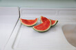 © Amanda Greene - watermelon slices on white counter with rind