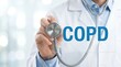 © LA Stock Vision - Close up of a physician with a stethoscope and COPD chronic obstructive pulmonary disease label.
