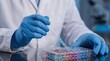 © dom studio - laboratory sample analysis and scientific testing. gloved scientist pipetting colorful liquids into multiwell plate. precise chemical research in modern lab environment.