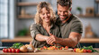 © The Little Hut - Happy Couple Preparing Fresh Healthy Meal Together in Bright Modern Kitchen