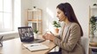 © Tanvir - Customer support representative explaining ideas during video call with headset