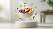 © MD. HAFIZUR RAHMAN  - Levitating bowl of fresh mixed fruit salad with berries and tropical slices on a podium