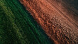 © Shelley - Aerial View of Contrasting Agricultural Zones: Lush Green Rice Fields Meet Barren, Drought-Stricken Land