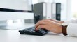 © SunSpirit - Sharp focus on hands of a volunteer typing on a desktop computer for secure recordkeeping with a blurred background.