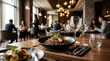 © BZXO - Restaurant table with a gourmet meal and empty wine glasses, creating a sophisticated and inviting dining atmosphere