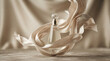 © BEST  - A clear glass perfume bottle with a round stopper positioned in the center, wrapped in flowing beige silk fabric that creates soft, curves against a neutral background