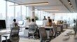 © Wannaeka - Blurred interior of a contemporary open plan office featuring workstations and computers.
