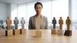 © Komang - HR recruitment diversity, professional businesswoman blurred in background selecting candidates, miniature human figures on pedestals on wooden desk, corporate office interior, ideal for hiring ads,