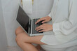 © Thitiporn - Work addiction concept. Young woman uses laptop while sitting on toilet in home bathroom, showing remote work overload, laptop, working, toilet, bathroom, multitasking, technology