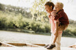 © BGStock72 - Joyful moments of friendship by the lakeside in a sunny afternoon