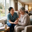 © Ulil - Compassionate Caregiver Assists Elderly Woman In Retirement Home