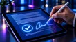 © Alfaqih - Electronic signature on digital tablet screen with glowing checkmark representing secure paperless business contract agreement