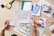 © Pixel-Shot - Female interior designers hands with color palettes and drawing of kitchen at table in studio, top view