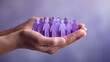 © Viktoryia - hands holding purple paper people representing diversity, inclusion, teamwork and psychological safety, human resources, employee wellbeing, corporate training