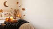 © Shot By Pixeon - Cozy autumn bedroom with a wooden tray of candles and dried flowers on a soft warm bed