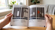 © Al - A close-up shot of a person's hands holding open an instruction manual detailing the operation of vertical blinds, with clear diagrams and step-by-step instructions.
