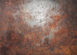 © Vectrology - Rusty metal texture, weathered iron surface, industrial orange corrosion on steel plate
