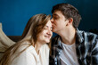 © ADDICTIVE STOCK - Young couple share a tender kiss at home