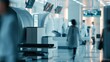 © Ulivers - Healthcare professionals moving around large diagnostic equipment in
